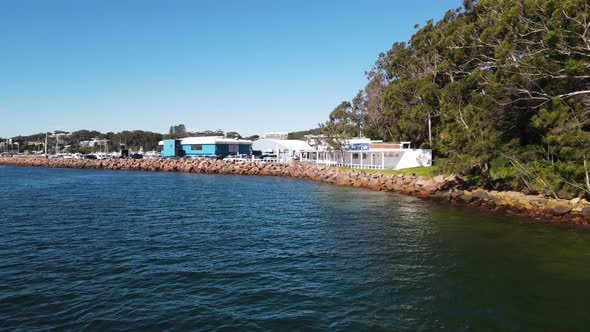 Fast revealing view over water of a popular scuba diving spot the pipeline at Nelson Bay Port Stephe