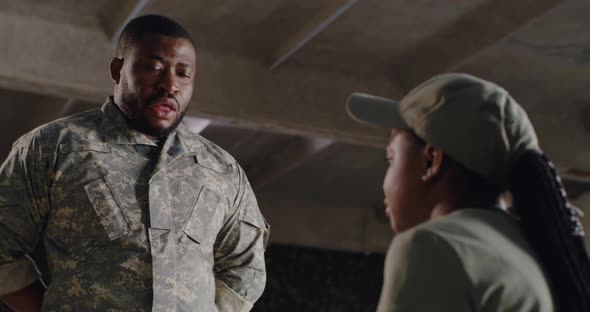 Black Officer Scolding Female Soldier