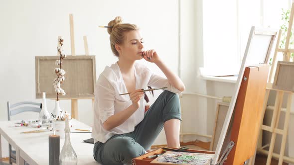 Young Beautiful Student Painting a Masterpiece at Home