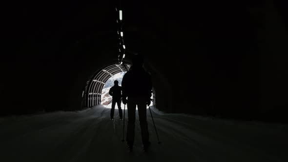 Woman Skiing Through Ski Tunnel