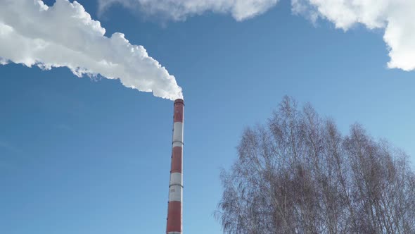 Smoke Coming From the Pipes of Heat and Energy Plants Over Winter City