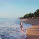 Beautiful girl walking along the beach - VideoHive Item for Sale