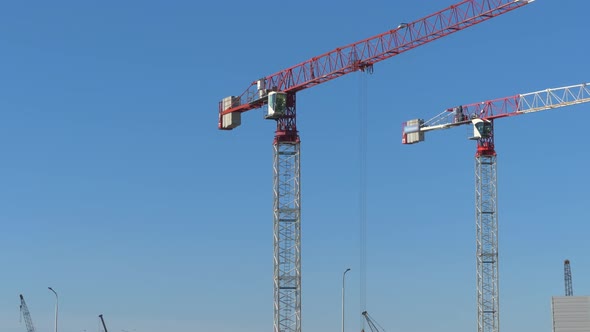 Construction Crane is Working on a Construction Site