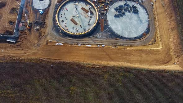 Industry among nature. Construction site of a new biogas plant on field.