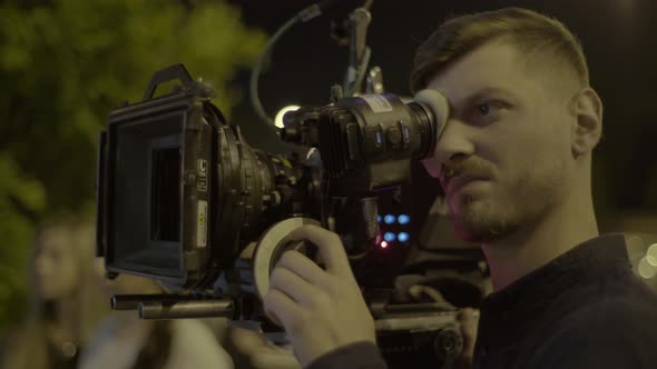 Cameraman with a Camera During Filming. Filmmaking. Shooting.