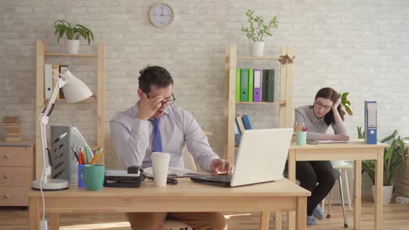 Sleepy Office Workersman and Woman Sleep at Work