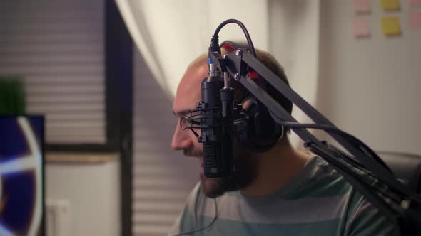 Closeup of Streamer Man Talking Into Microphone