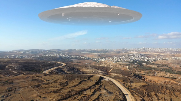 Alien Spaceship ufo Hovering over hills-Aerial view