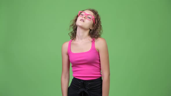 Young Beautiful Nerd Woman Thinking with Eyeglasses