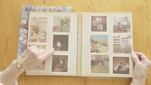 Senior Woman Looking at An Old Photo Album 