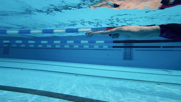 Professional Male Athlete Swimming Underwater