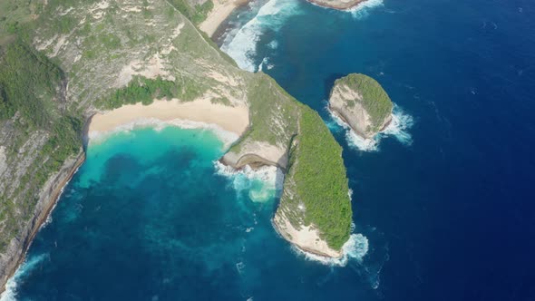 Aerial View of Kelingking Beach in Nusa Penida Island Azure Ocean Mountains