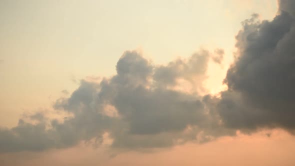 Time lapse sunset sunrise and beautiful twilight fluffy storm cloudy blue and yellow sky