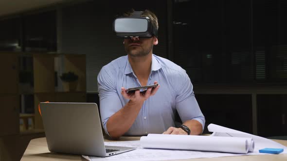 Businessman using VR helmet in a modern office