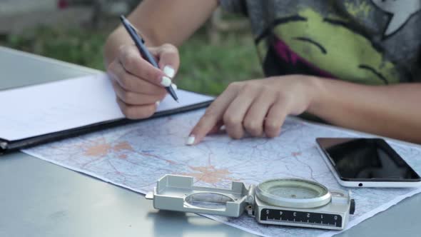 The Girl is Preparing for the Tourist Trip