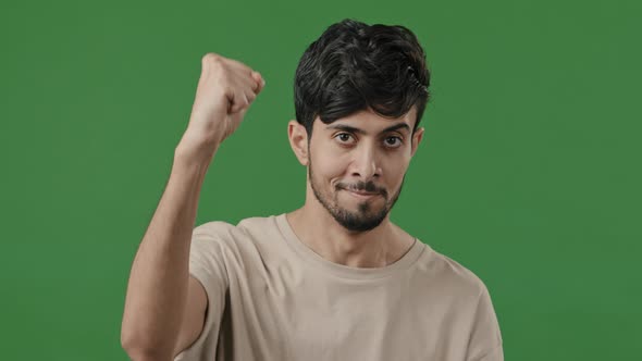 Arabian Motivated Activist Young Indian Man Raises Clenched Male Fist in Air Demonstrate Unity Power