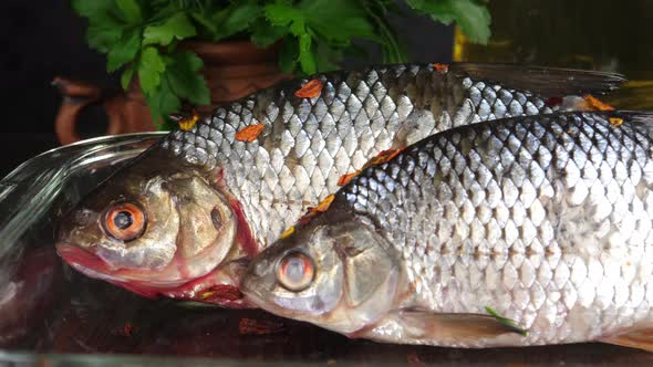 Cooking fish in a dish.