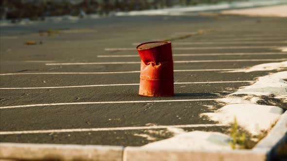 Old and Rusty Metal Barrel on Parking