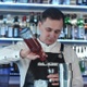 Young Handsome Barman in Bar Interior Mixing Alcohol Cocktail - VideoHive Item for Sale