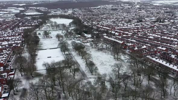 Aerial footage of a snowy winters day in the city of Leeds in the UK