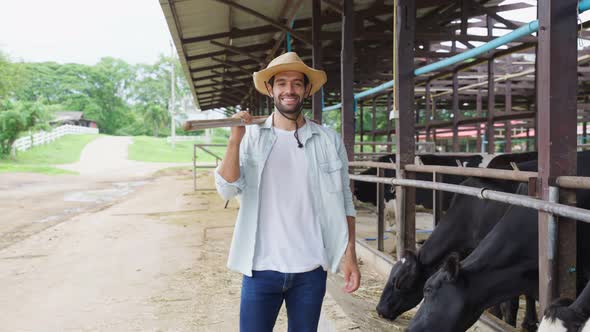 Portrait of Caucasian male dairy farmer working outdoors in cow farm.