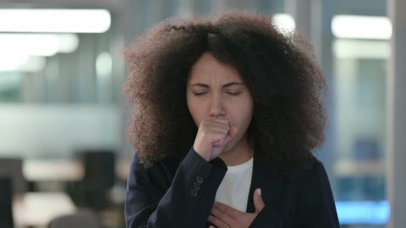 Portrait of Sick African Businesswoman Coughing