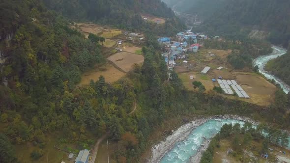 Valley With Villages Along Mountain River. Nepal. Aerial Footage