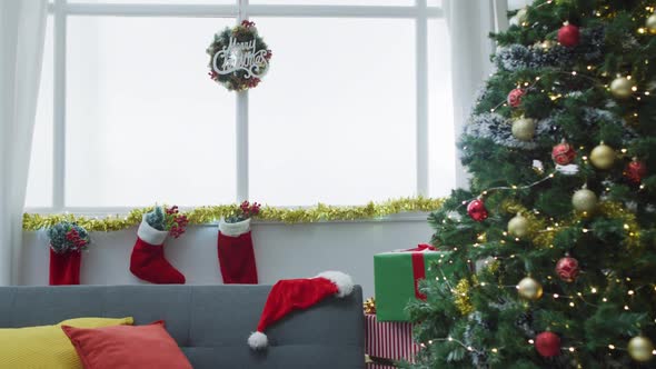Video of christmas greetings, decorations, christmas tree, lights and christmas stockings at home