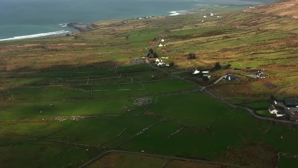 Loher Ringfort, Kerry, Ireland, March 2022. Drone orbits the ancient monument from the south while d