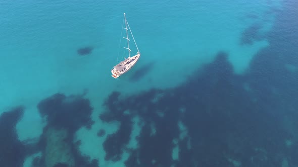 Boat sailing through transparent waters