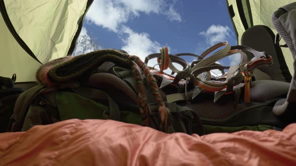 Ready for Mountain Climbing. Camera Moves Inside Tent Where the Sleeping Bag, Backpack, Crampon