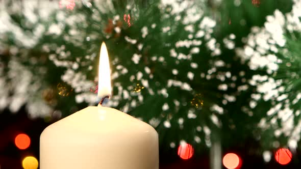 Top of White Candle with Christmas Decorations and Tree on Black, Bokeh, Light, Garland