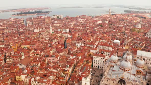 narrow canals and orange rooftops in Venice