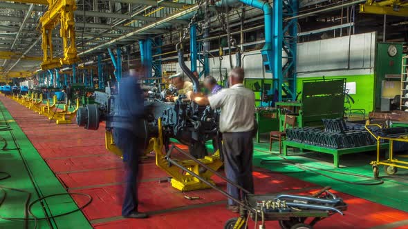 Conveyor Assembly Stage the Body of Tractor at Big Industrial Factory Timelapse