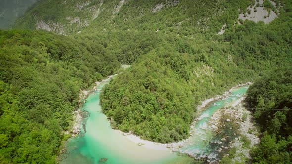 Aerial view of the calm and transparent water at the Soca river in Slovenia.