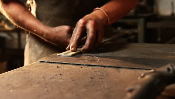 Mid section of welder working