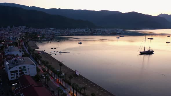 Aerial Panoramic View of Embankment Sea Bay and Mountains at Sunset