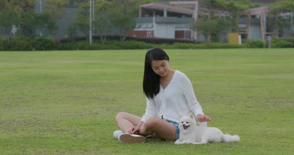 Woman play with her dog at park