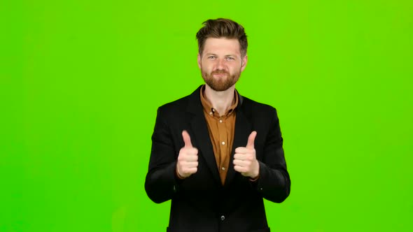Guy Businessman Shows Thumbs Up on Both Hands. Green Screen