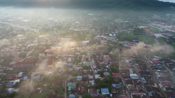 Aerial view shinny cloud over Malays rural housing area