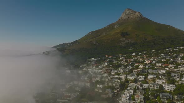 Aerial View of Camps Bay Luxurious Residential Suburb and Steep Slope with Rocky Peak Above