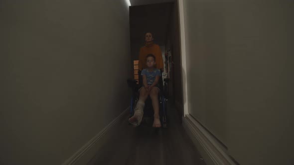 Mom with Injured Son in Wheelchair