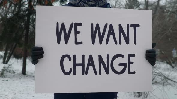 We Want Change Message Held By Adult Male Citizen In Social Justice Protest