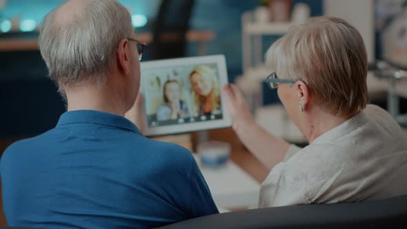 Retired People Using Online Teleconference to Call Family