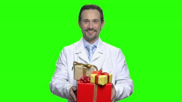 Mature Doctor with Gifts with Ribbon Bows