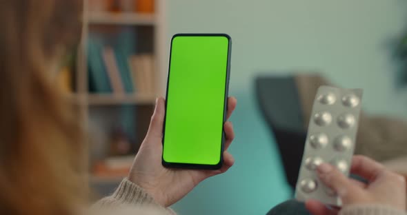 Woman Having Video Call with Doctor on Green Screen Mobile