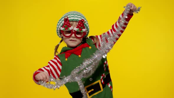 Kid Girl in Christmas Elf Santa Helper Costume Dancing Fooling Around