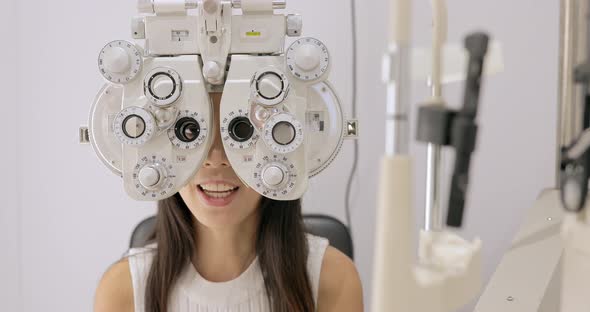Woman Is Visiting Oculist in Clinic