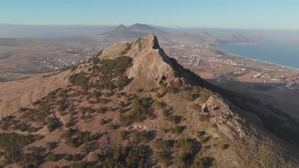 Aerial shot flying over Ana Ferreira peak summit beautiful Island Landscape