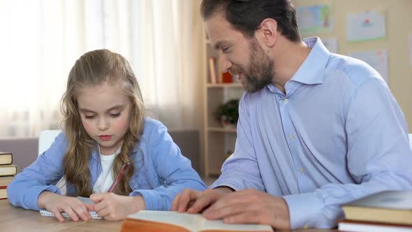 Proud Father Doing Homework Together With His Daughter, Education, Family Care